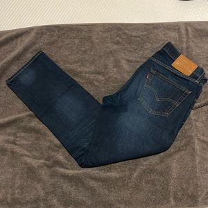 Levis Premium 511 size 33x30 in blue with fading on front and back legs